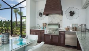 outdoor kitchen with brown naturekast cabinetry