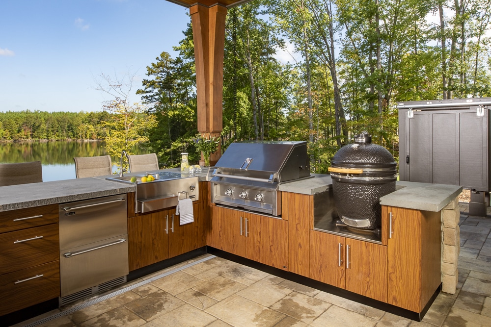 outdoor kitchen with tan cabinetry